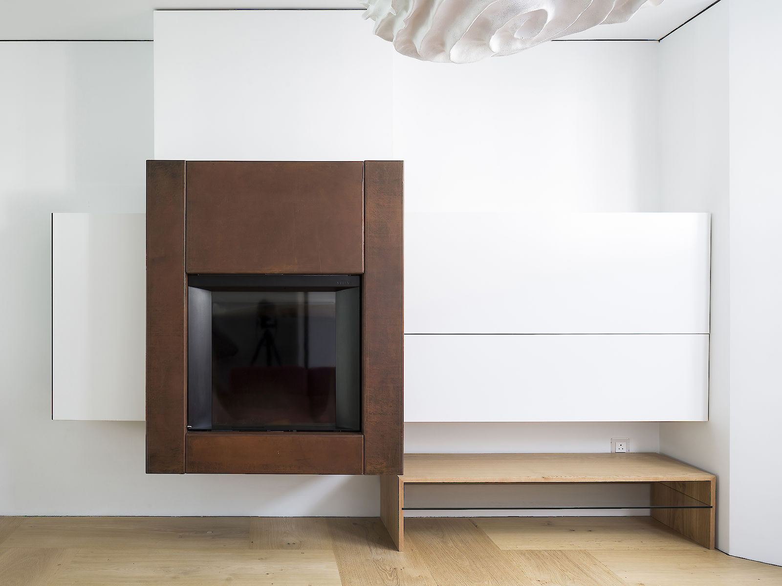 GC House by inaki leite design. Elevation of fireplace in oxidized steel designed by iñaki leite