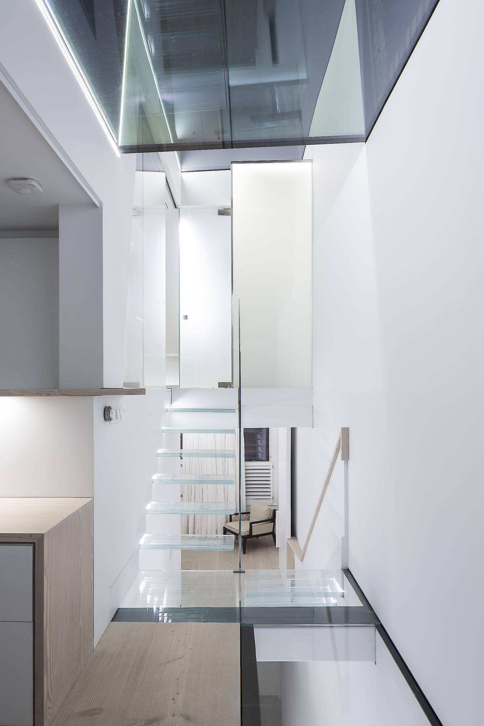 GC House by inaki leite design. Lighting of Fulham house glass stairs to loft from half landing and shower room designed by iñaki leite