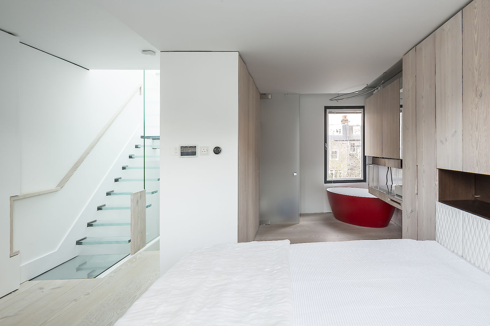 GC House by inaki leite design. Fulham house master bedroom entrance with en-suite and Dinesen cupboards designed by iñaki leite