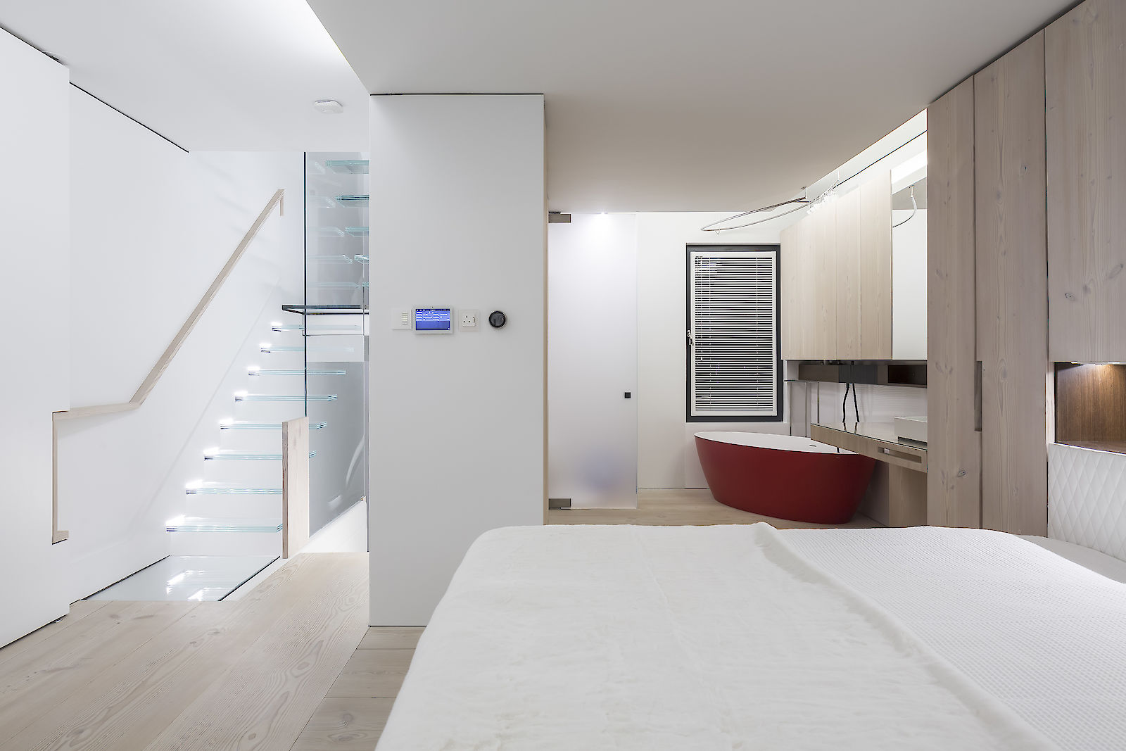 GC House by inaki leite design. Lighting of Fulham house master bedroom entrance with en-suite and Dinesen cupboards designed by iñaki leite