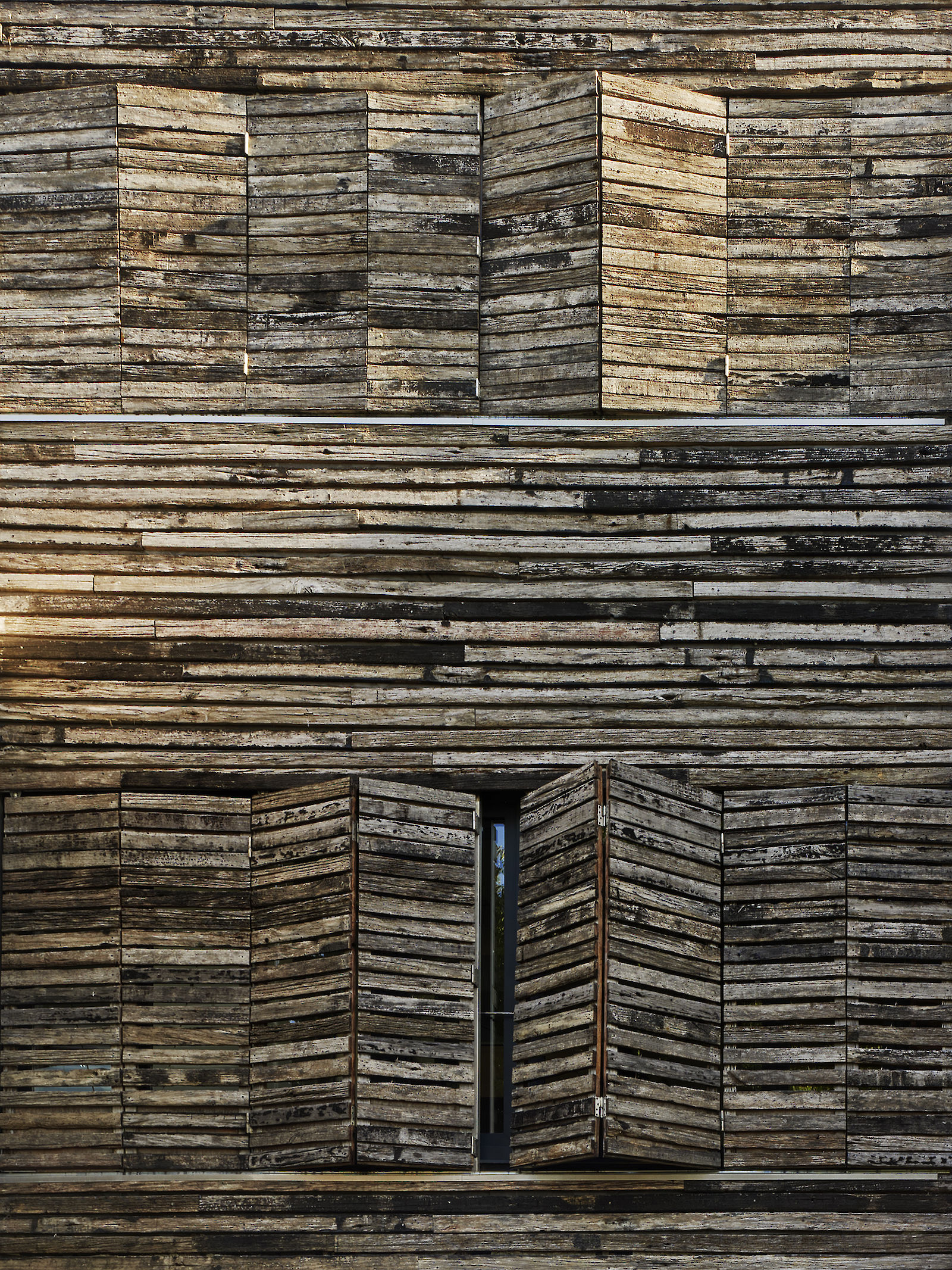 Dezanove House designed by iñaki leite. Facade shuttering detail